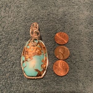 Hand wrapped turquoise pendant with silver plated